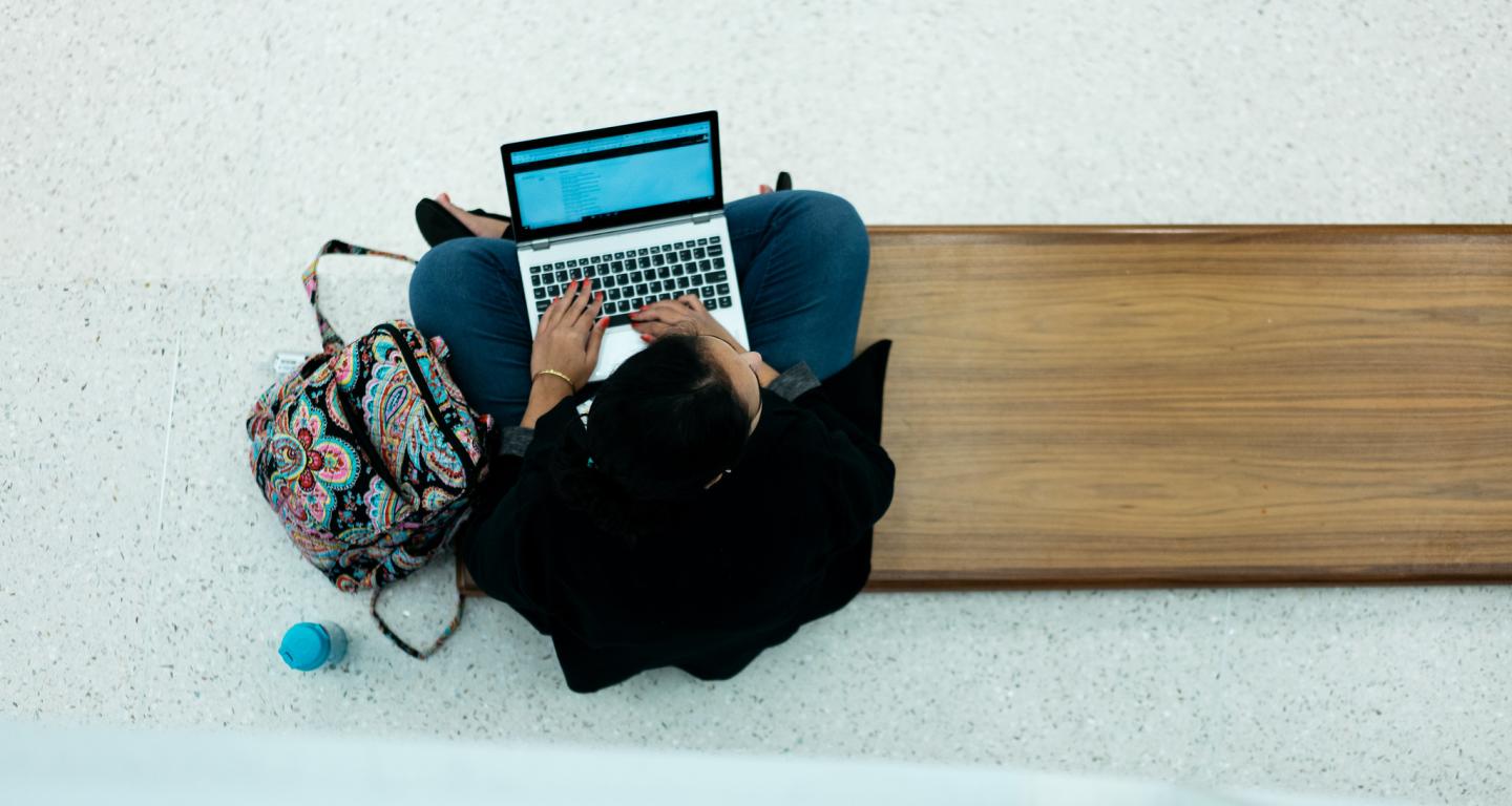 student studying with laptop
