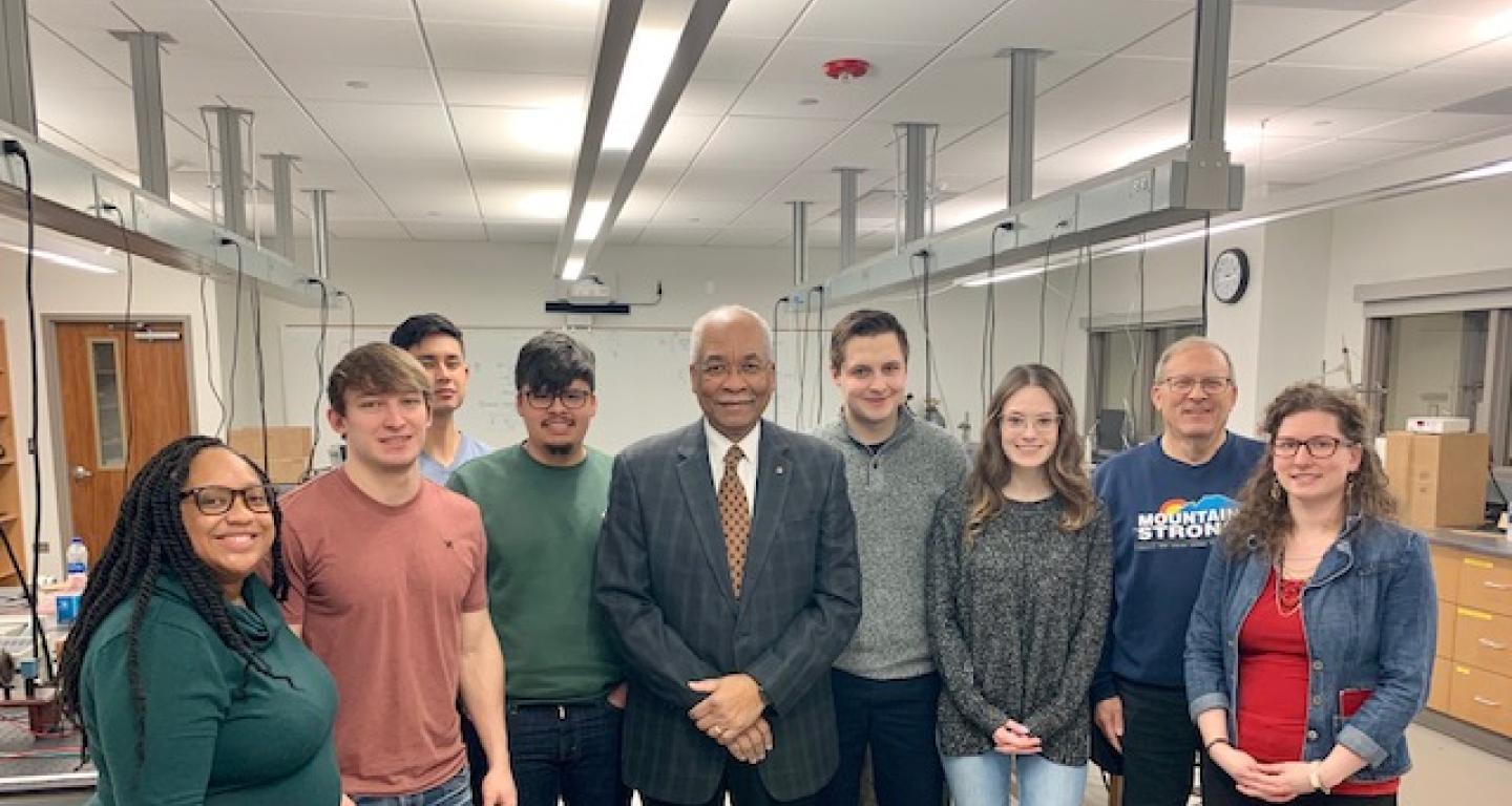 Dr. Herman B. White with students