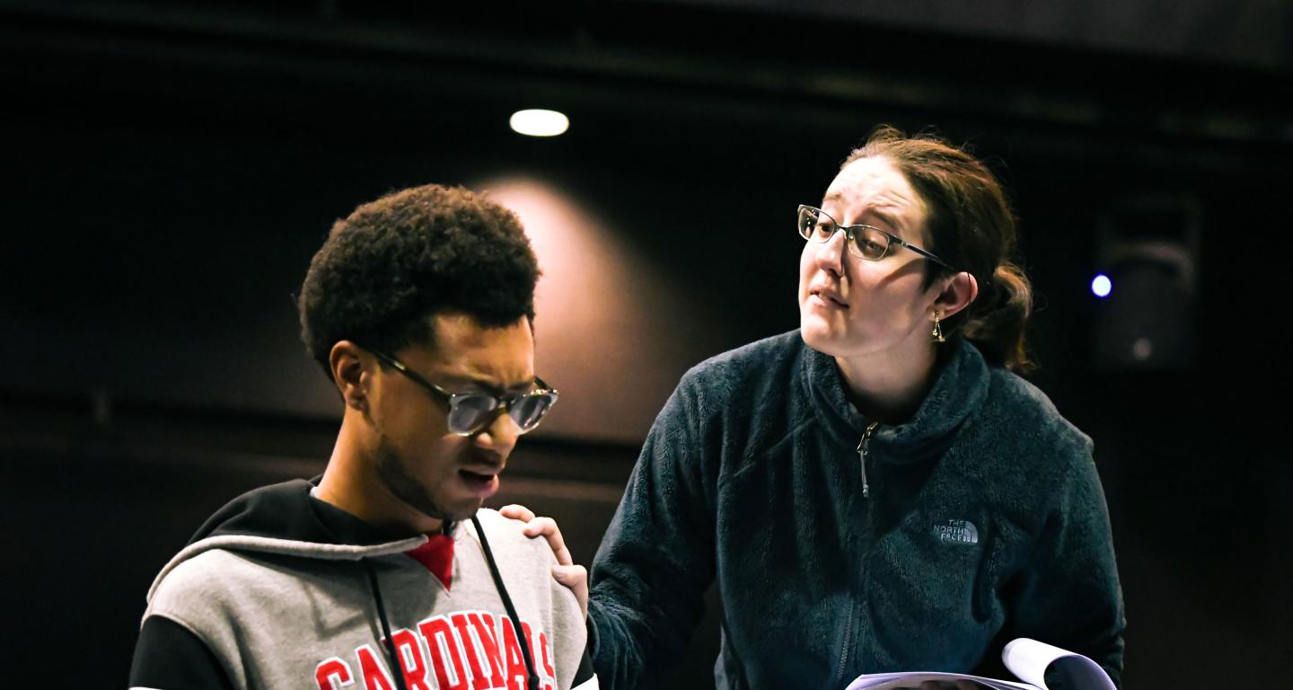 two students rehearsing theatre production