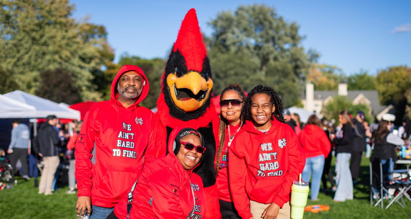 Family posing with Chippy the mascot