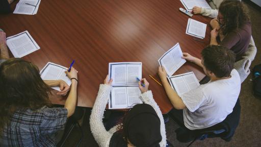Shimer Students discussing an essay at a round table 