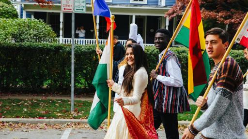 international students walking with national flags