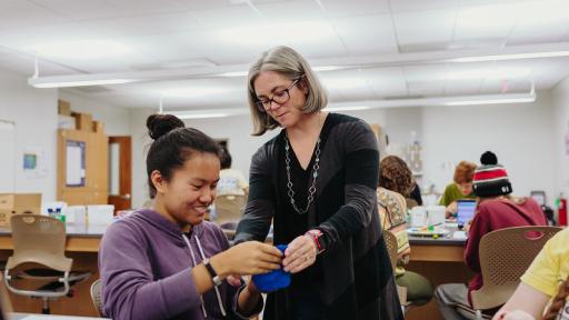 Faculty member helping a student